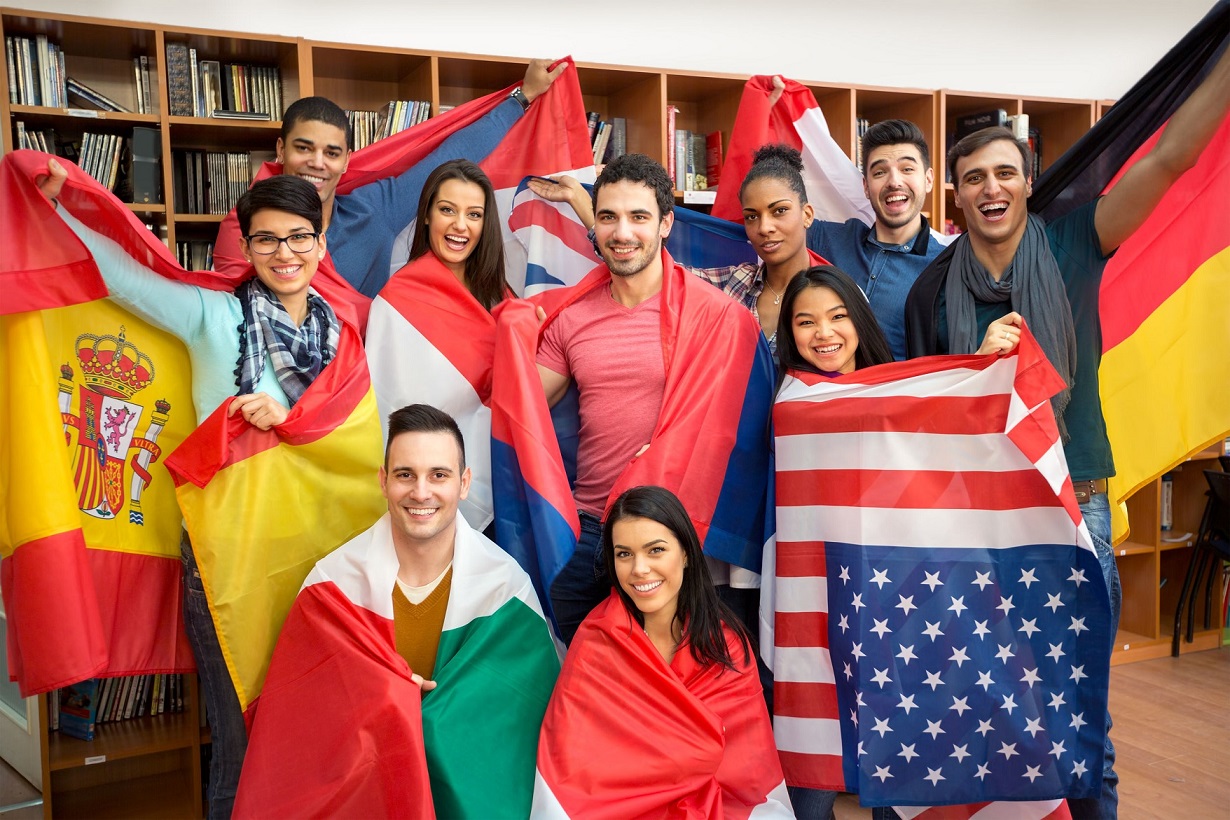 students presenting their countries with flags