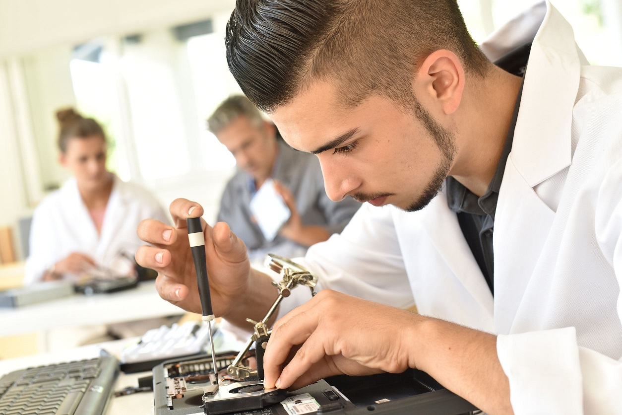 male student in technical college class