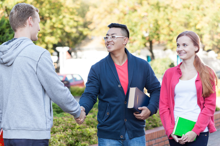 diverse student making friends in America