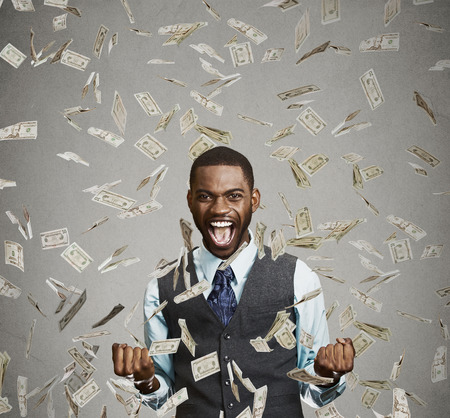 man celebrates success screaming under money rain falling down (company scholarship)