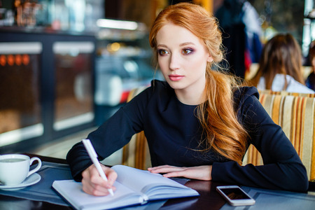 young female writer pondering over 500 word essay