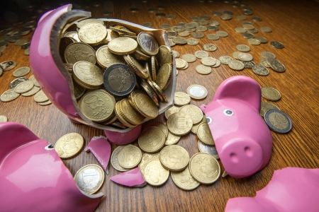 cracked pink pig moneybox closeup concept for unclaimed scholarships