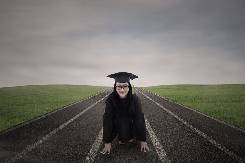 female graduate wearing graduation gown ready to race outdoor concept for boston marathon runner-up plans to spend prize money paying off student debt