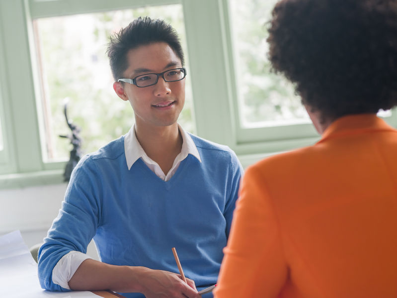 young candidate having an interview with his employer concept for scholarship interview questions and answers