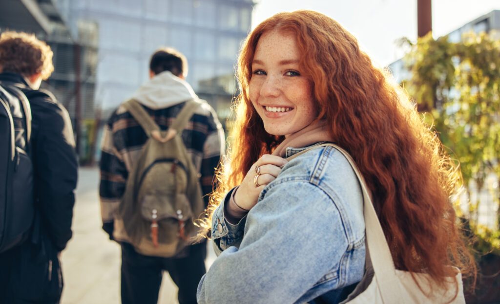 Girl walking behind a group of students