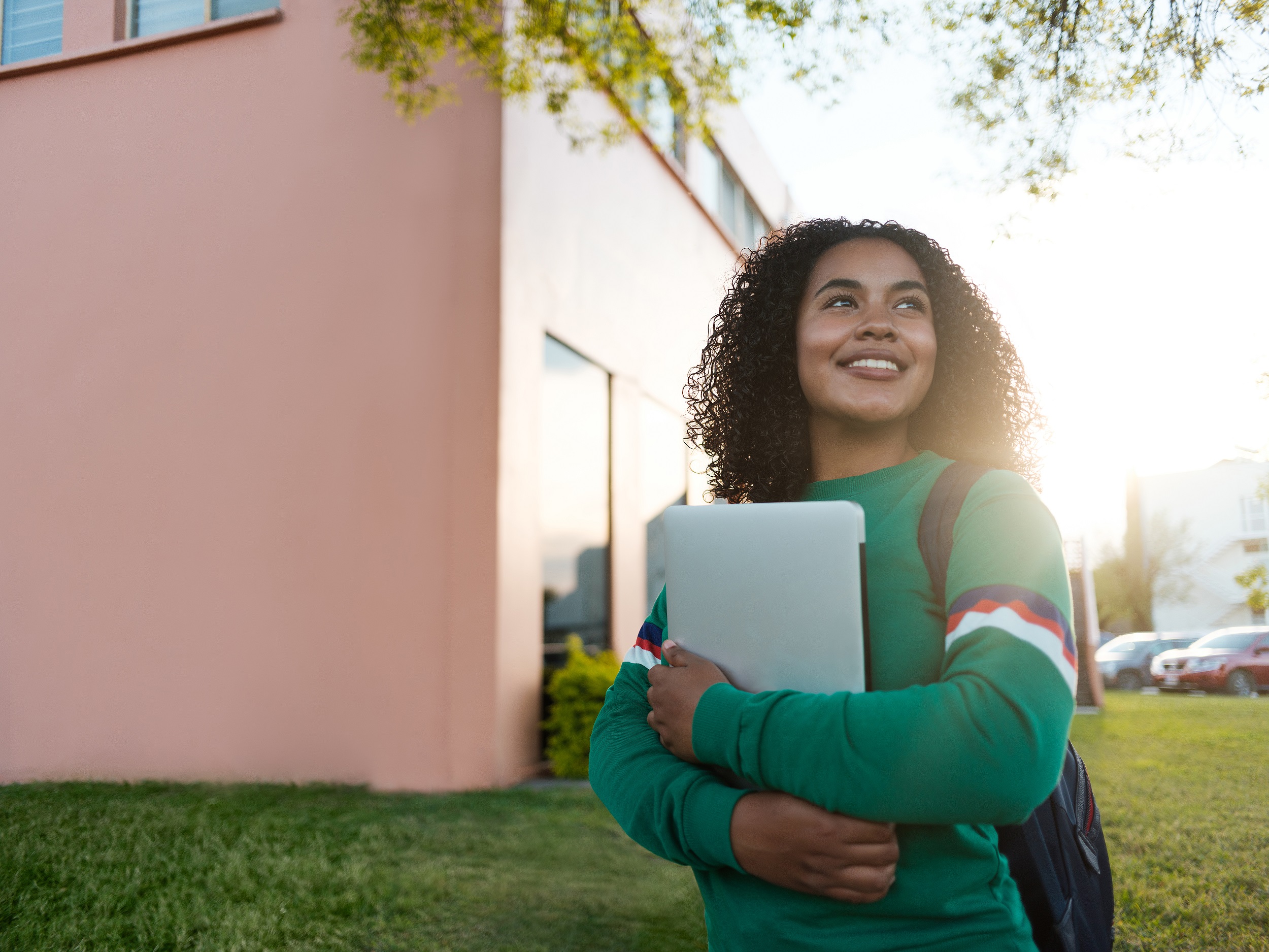 Cheerful college girl gazing to the side