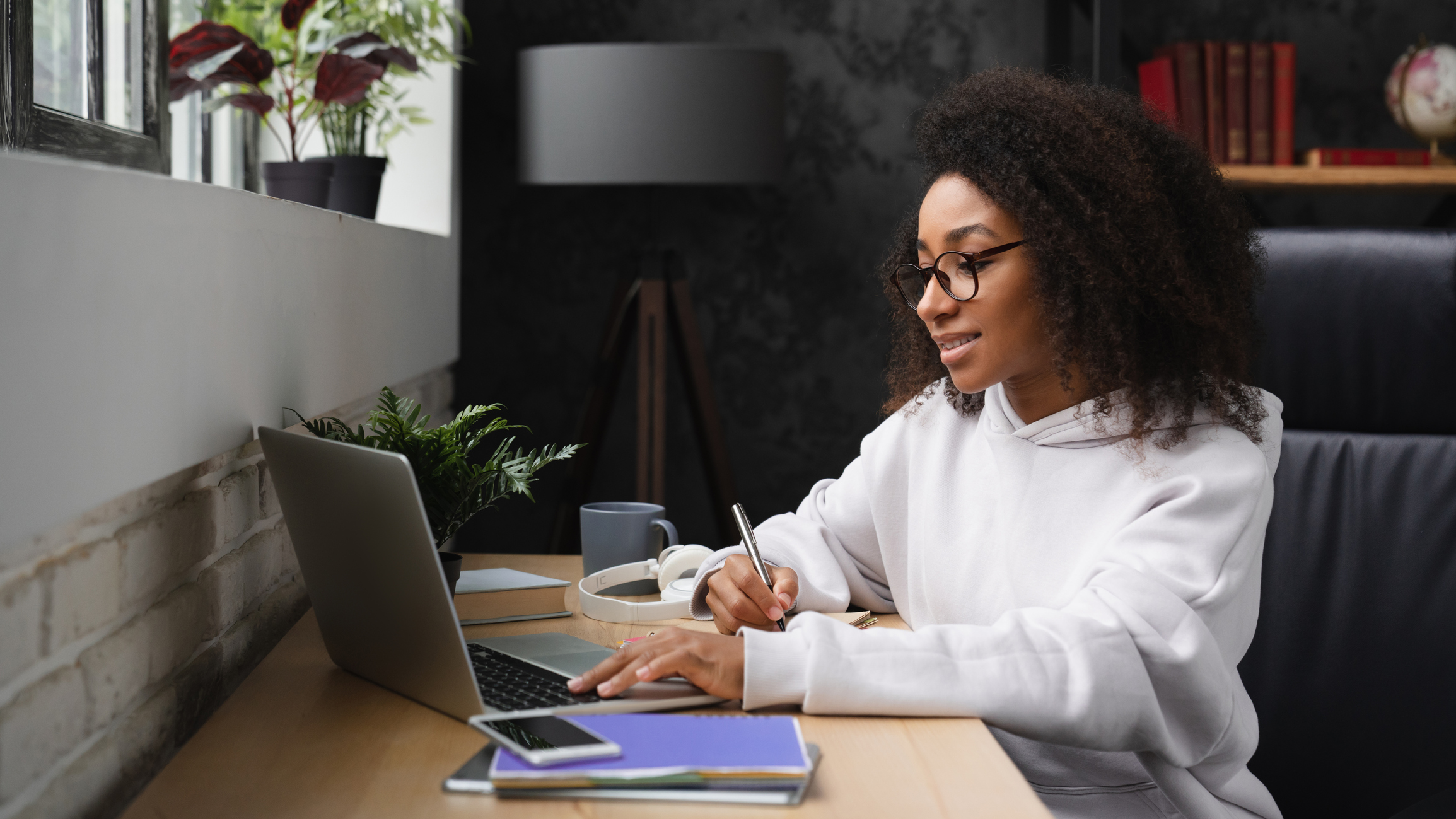 Student applying for scholarships on laptop