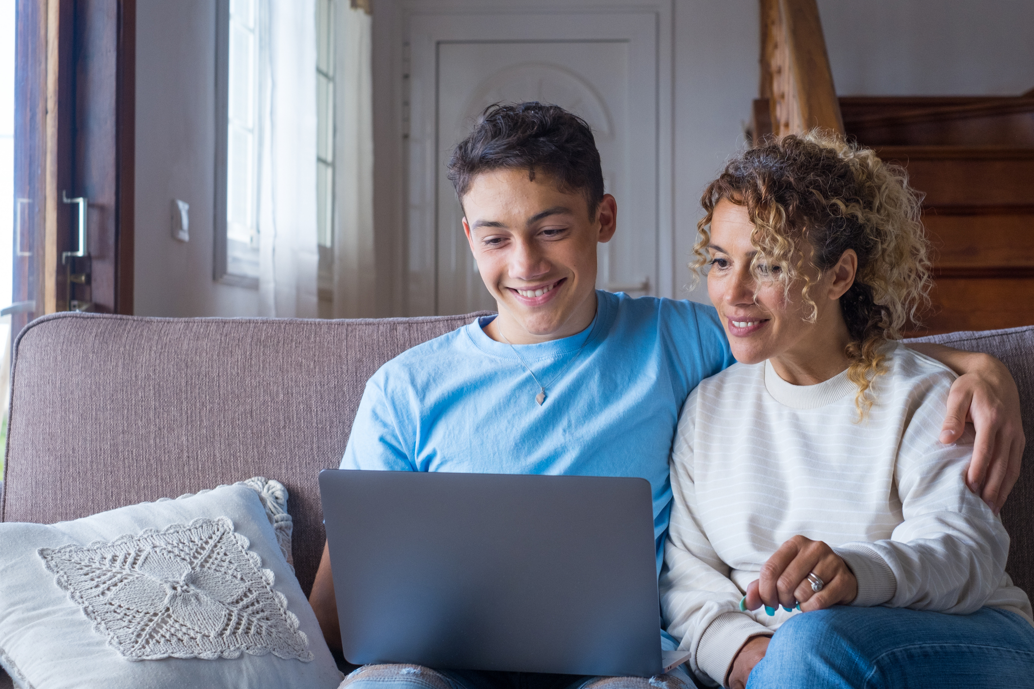 mother and son on laptop