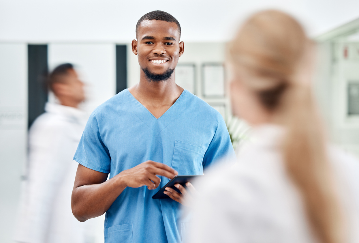 Male nurse, surgeon or doctor with tablet and 5g network medical research, information technology or answer online consultation with medical insurance. Healthcare college major, portrait and smile of man using app