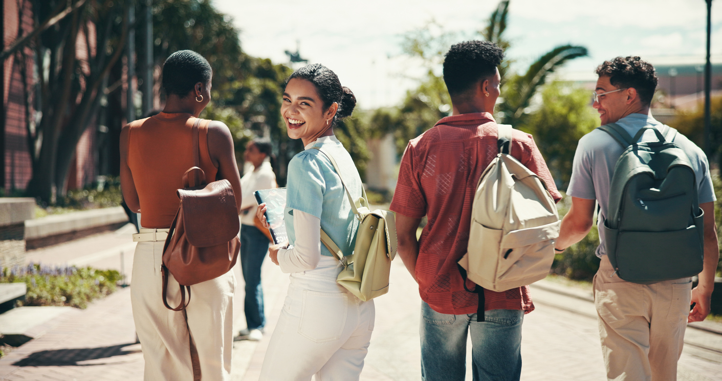 Education, laughing and walking with student friends outdoor together for learning or study at university. College, funny and portrait with learner group at school for knowledge or scholarship