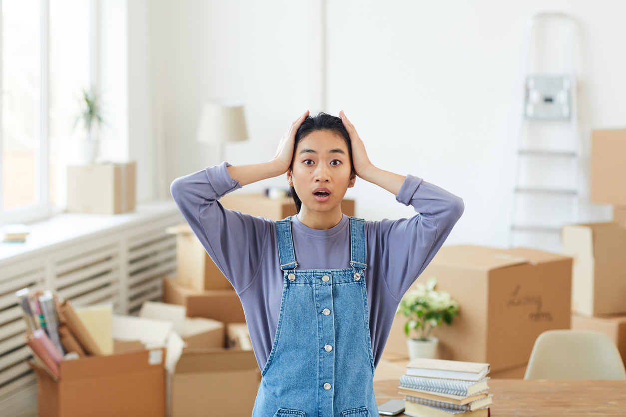 Young Asian Woman Panicking when Moving into her dorm room