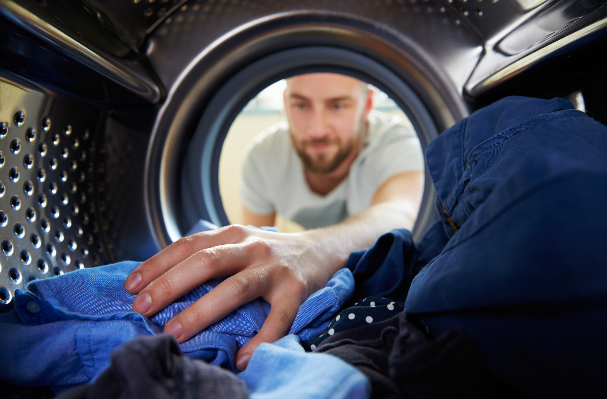 college student doing laundry