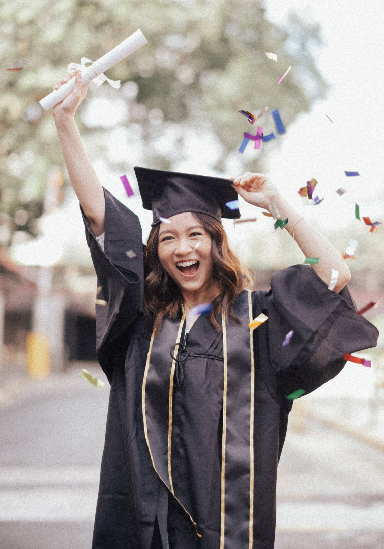 Excited college graduate in cap and gown