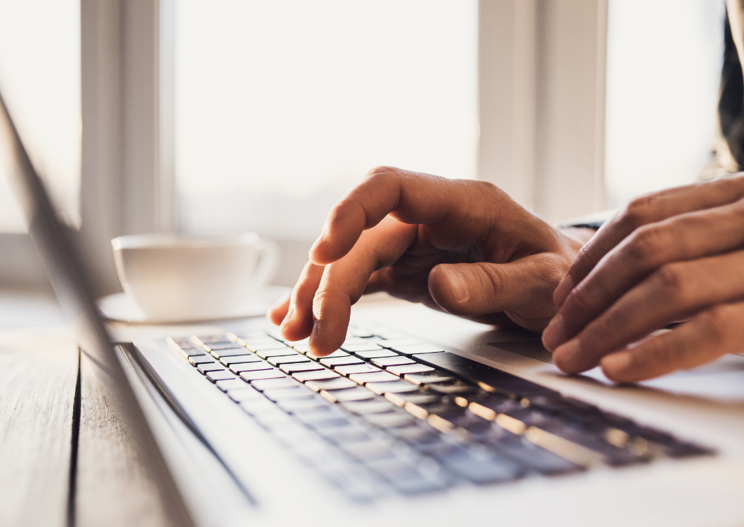 hands typing on keyboard - letter of recommendation
