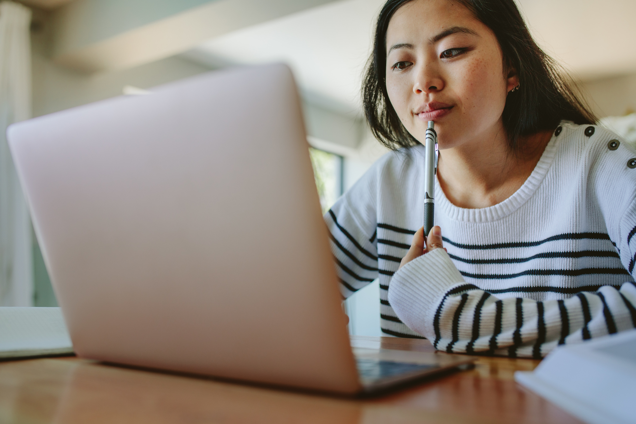 Asian student on laptop