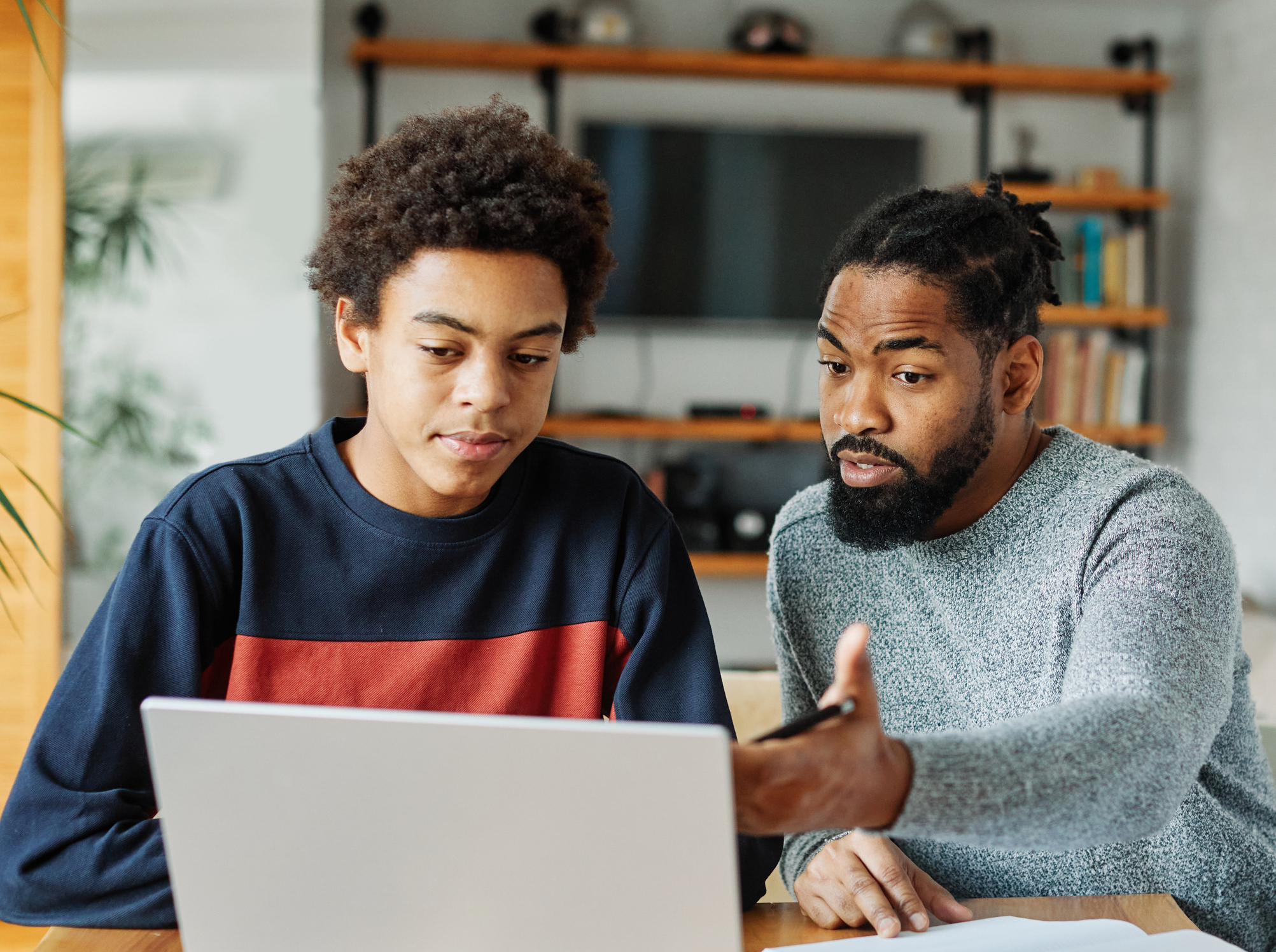 Dad and son working on the FAFSA