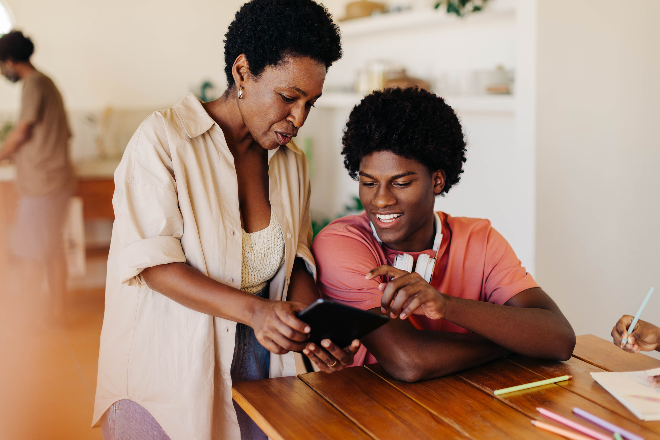 mom and son on tablet at home