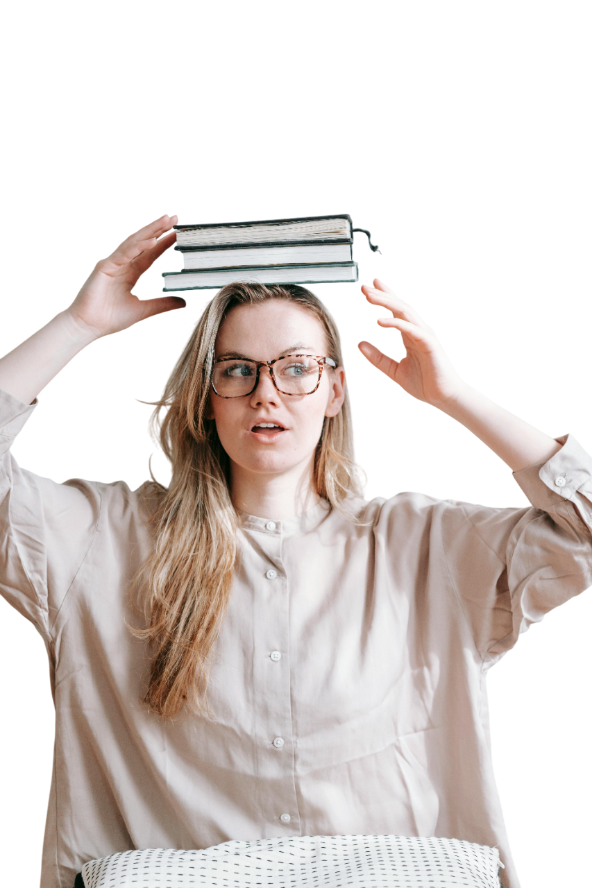 girl holding a book above her head