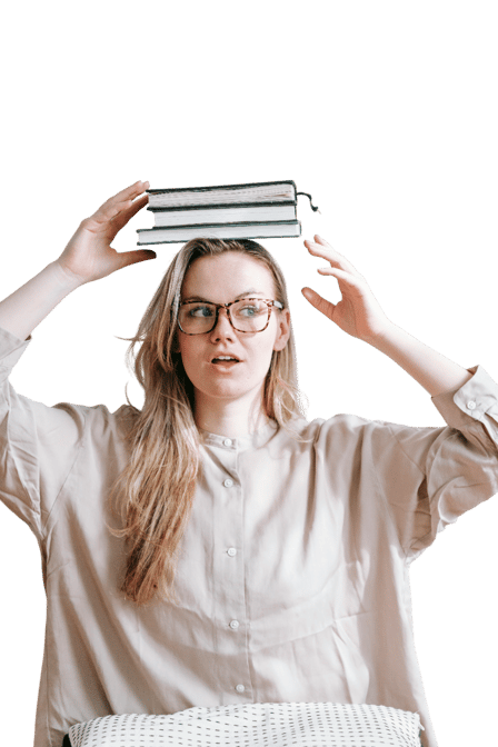 girl holding a book above her head